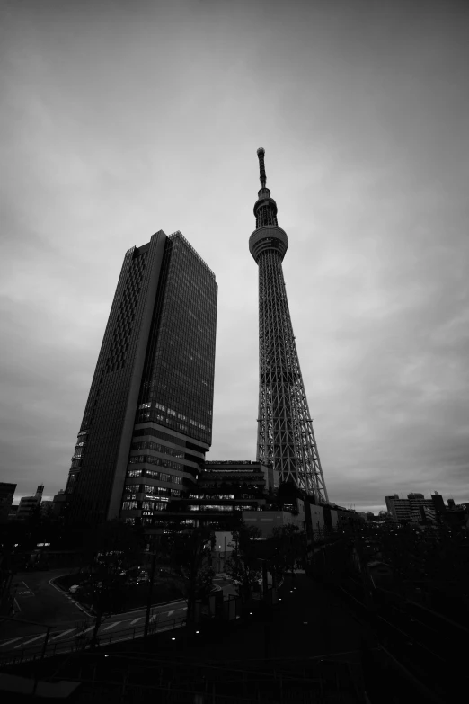 two black and white images one shows a large building and the other shows a tall building