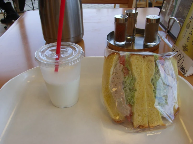 a tray with food and a drink on top of it