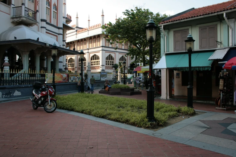 a motorcycle parked near the curb outside a building