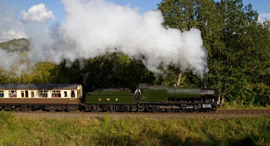 steam comes out of the top of a train