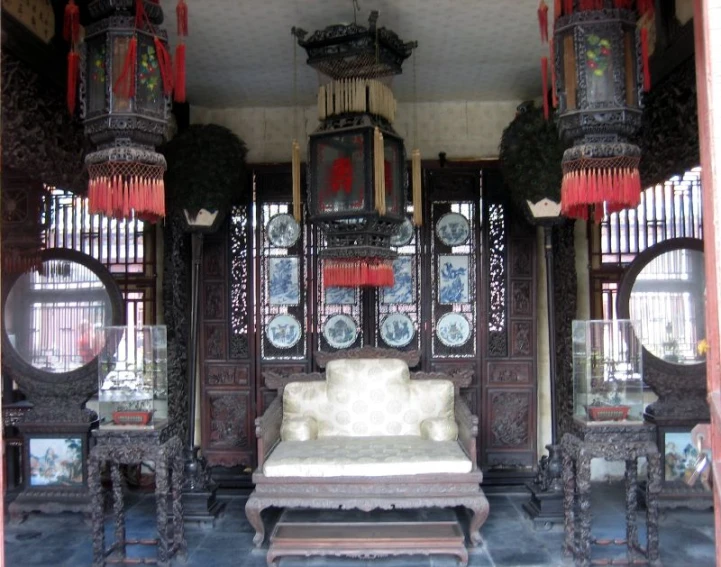 an old wooden room with oriental ornaments around it