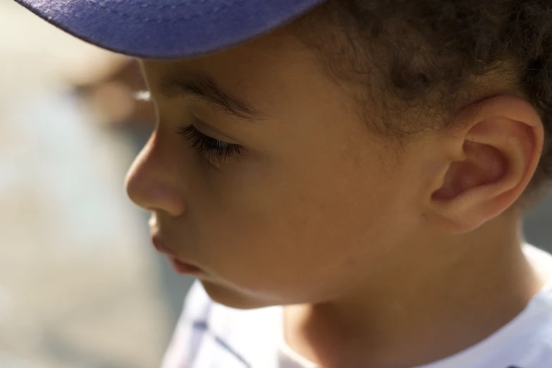 a small child with a hat on his head