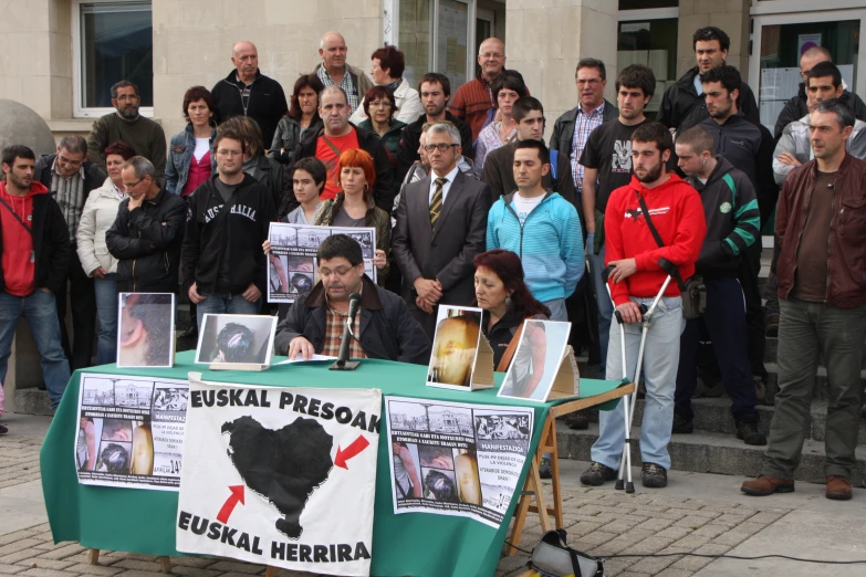 a group of people are gathered outside at a rally