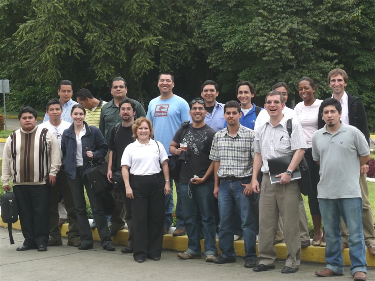 group of men and women standing close together