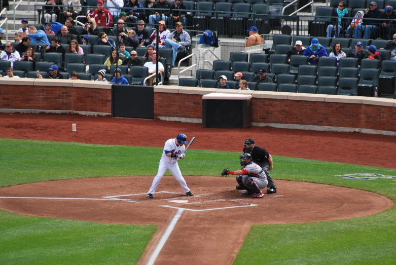 a baseball player swinging his bat at a ball