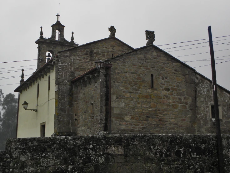 a church with a tower and a clock built into the side