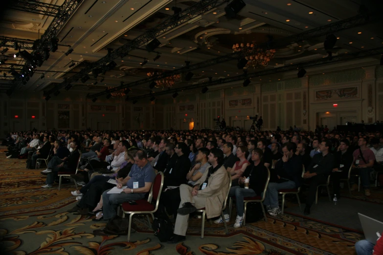 a room full of people sitting on chairs