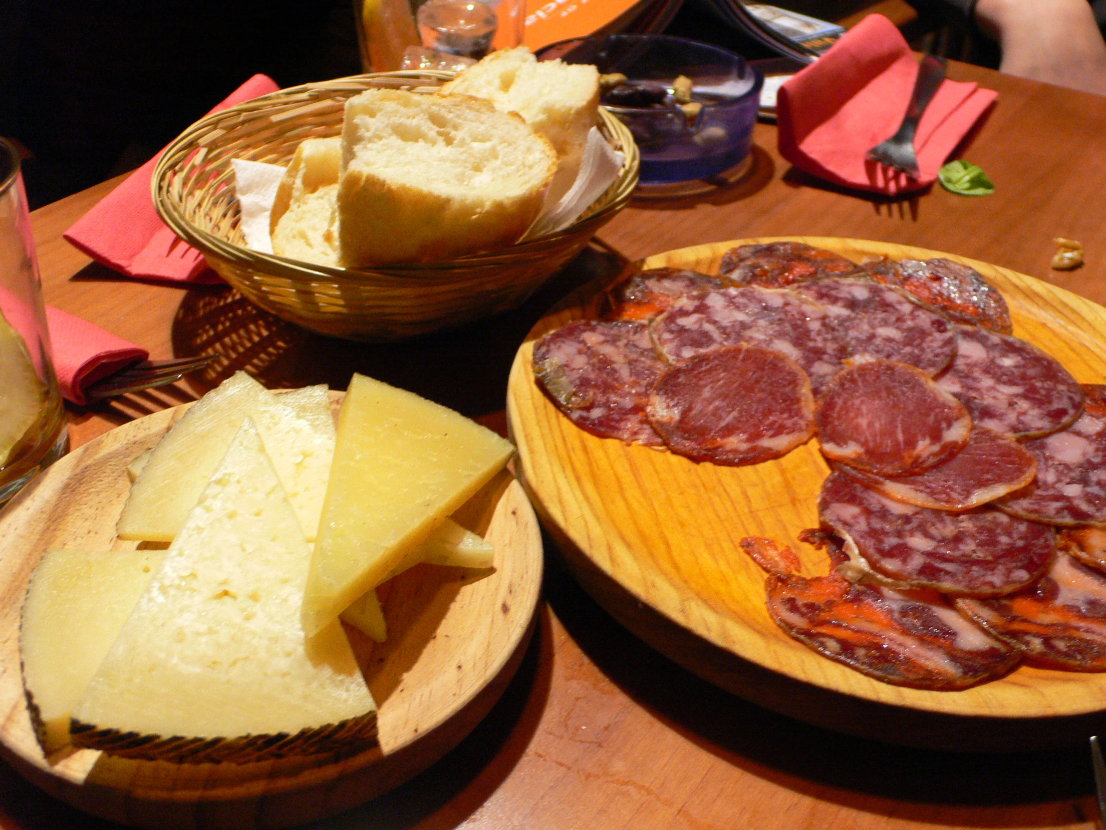 breads, salami and meat on the table