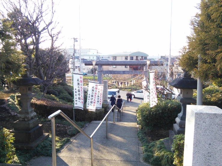 two people walking down an escalator in a park