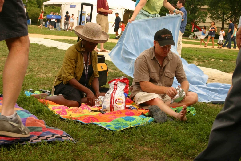 some people are having picnic at a park