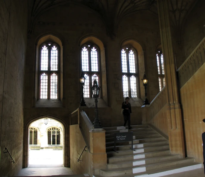 an open stairway in front of multiple large windows