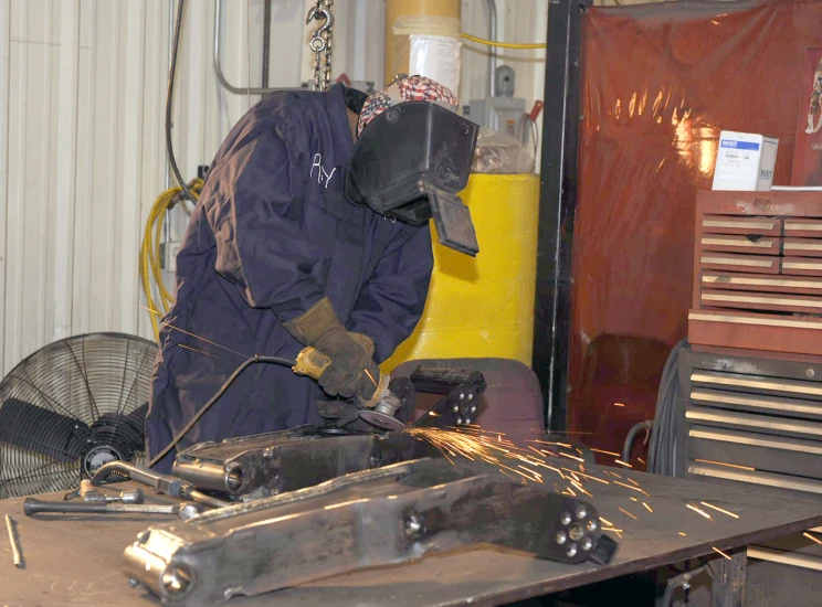 a man works in a large steel shop