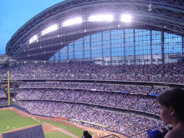 a baseball field with many spectators in it