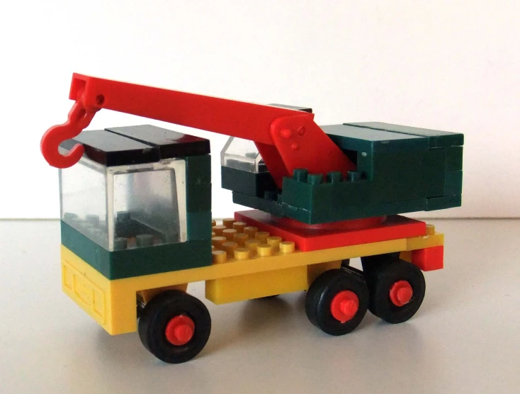 lego truck carrying large bricks with small container