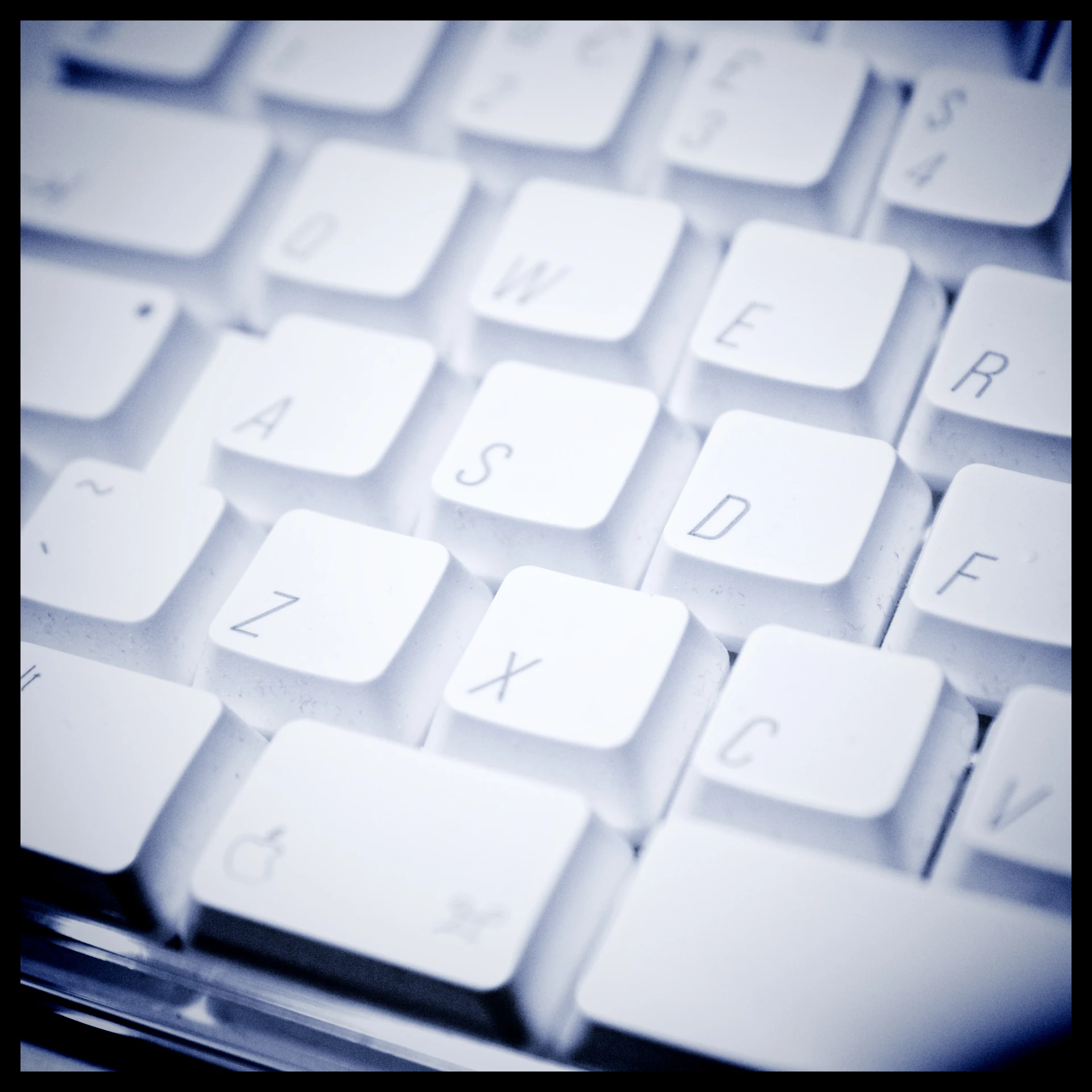 the backlit keyboard is white and black and has letters and symbols