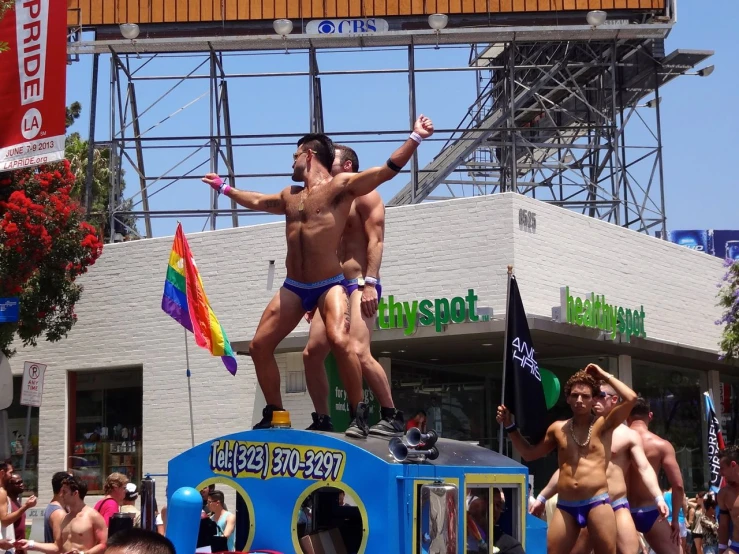 two men standing on the edge of a colorful boat