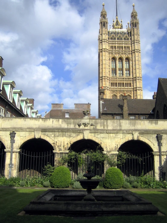 the clock tower has towers above its courtyard