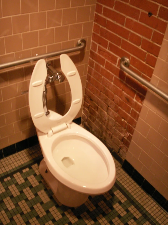 the bathroom is equipped with several toilet features