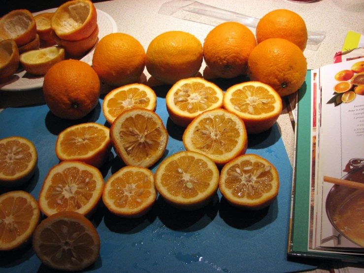many slices of orange sitting on a counter top