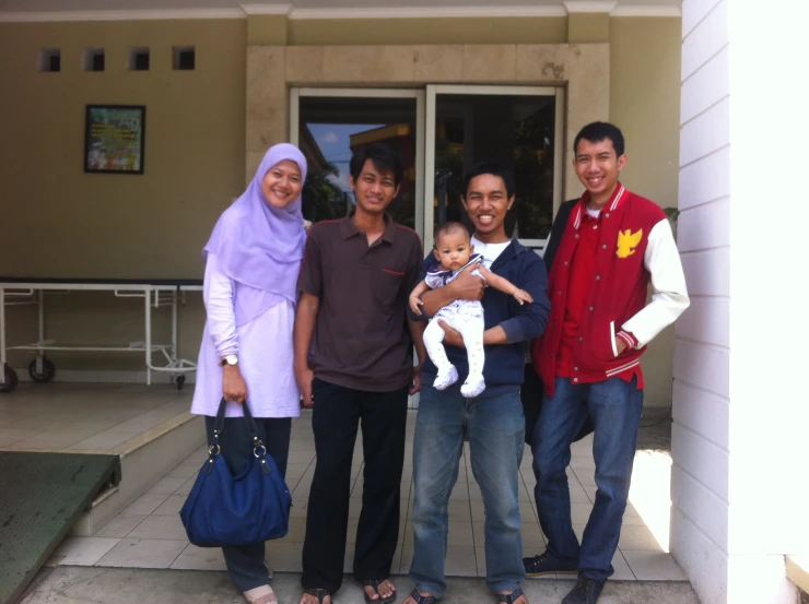 a group of people standing outside of a building