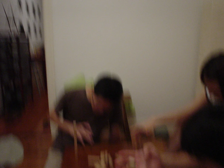 a blurry image of people playing around with toys