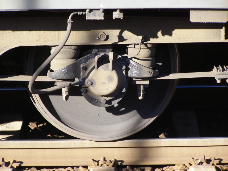 the rear wheel and handle of a train, viewed from below