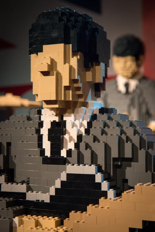 the lego figure is looking at soing with an expression