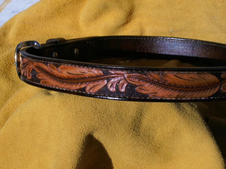 the back side of a collar, with a leather flower pattern