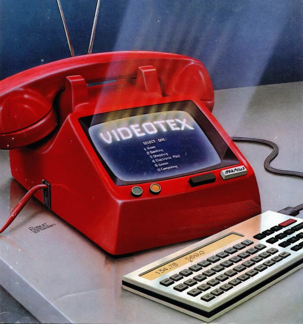 an old computer and calculator on a table