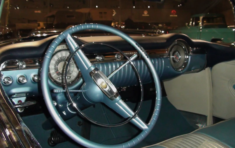 the interior of an old fashioned car with a dashboard and clock