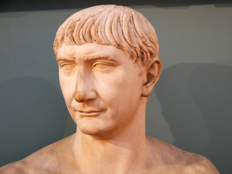 there is a bust of a man with short hair