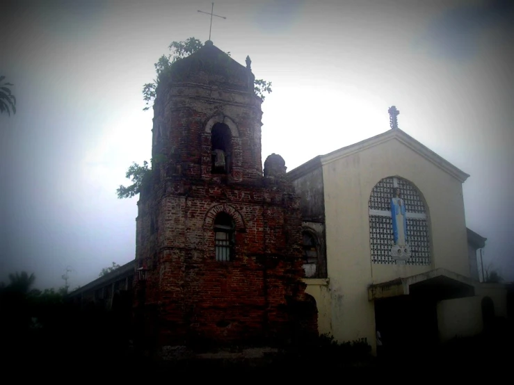 an old brick church is featured with an odd shape