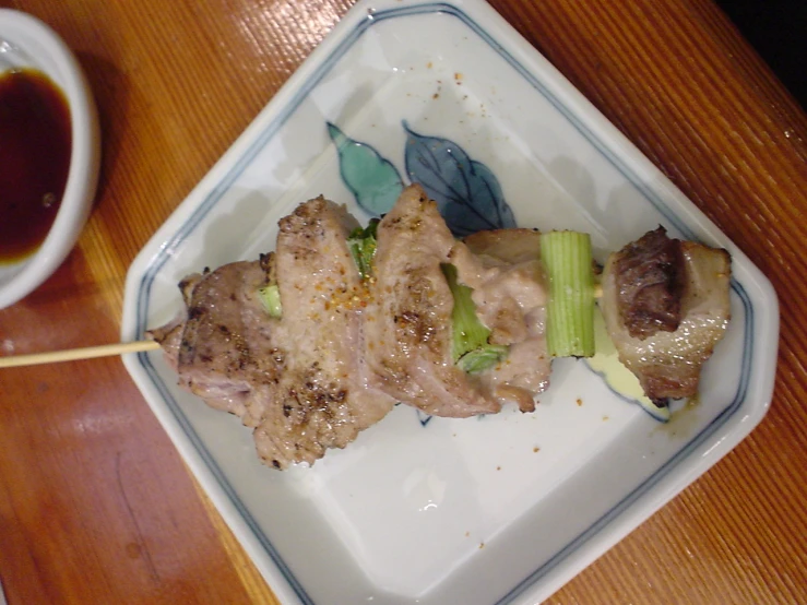 a plate with food on it is next to a cup