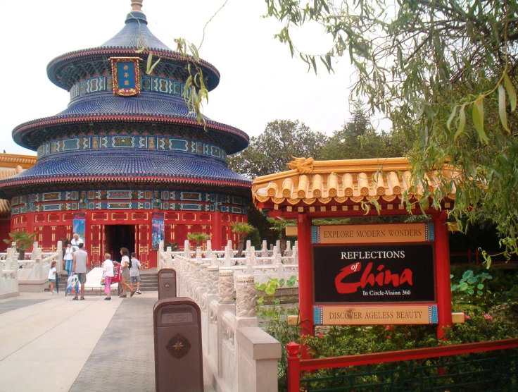 a large buddhist temple with a bell tower on it's side