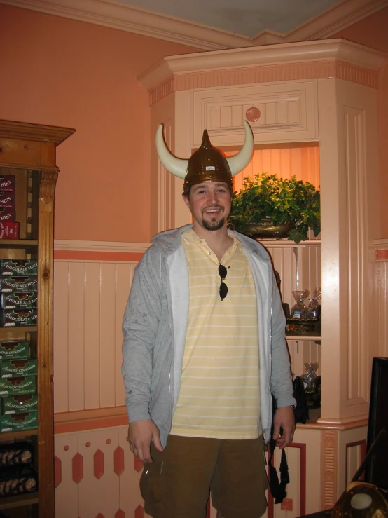 a man is wearing a costume with a bull's head