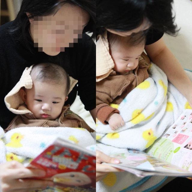 a mother reading a book to her child
