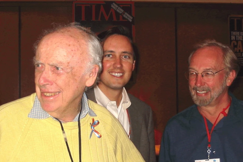 two men and an old man standing next to each other