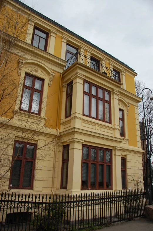 an old house with many windows on a gray day