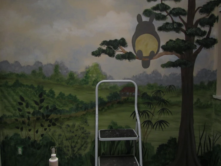 painting of forest scene on the wall above step ladder