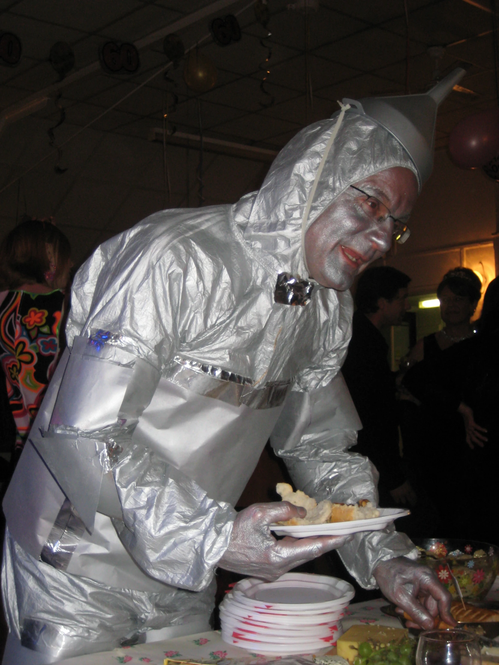 a person in white suit and a hat