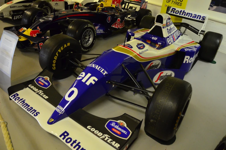 a large group of race cars are lined up