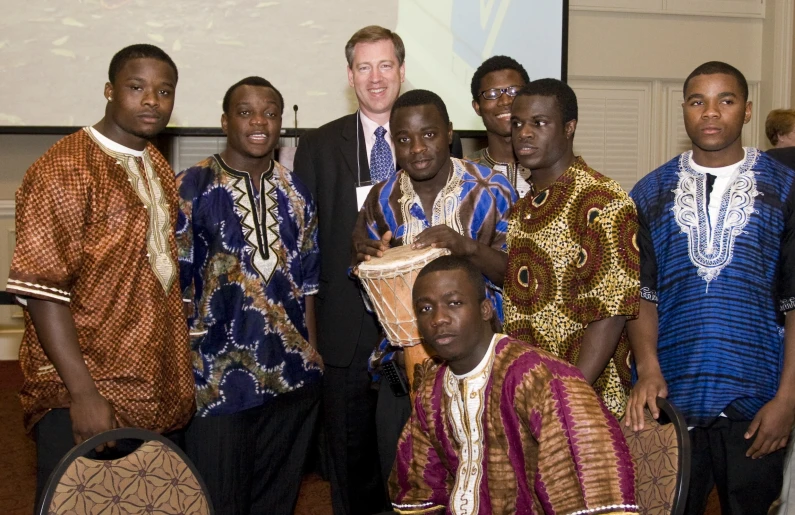 many men in african clothing posing together for the camera