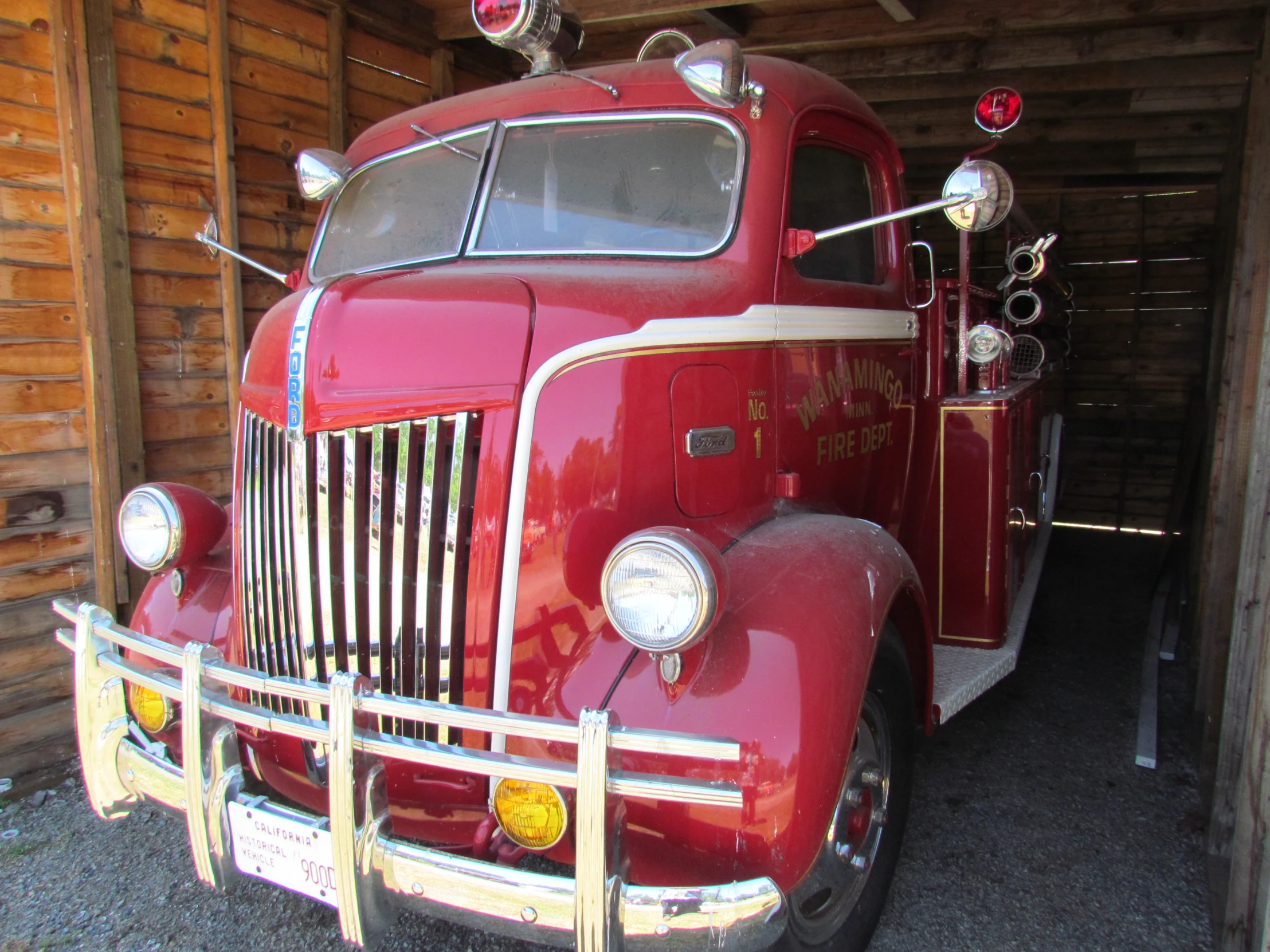 a large fire truck parked in a garage