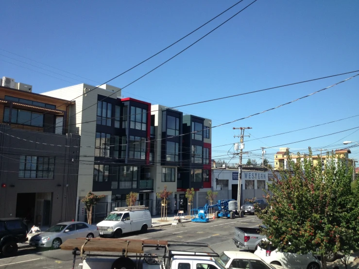 a street that has many cars parked in front