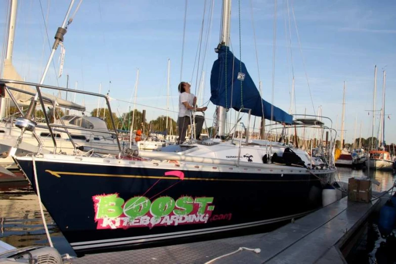 a man standing on the bow of a boat