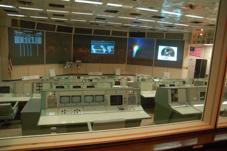 a control room full of machines and monitors