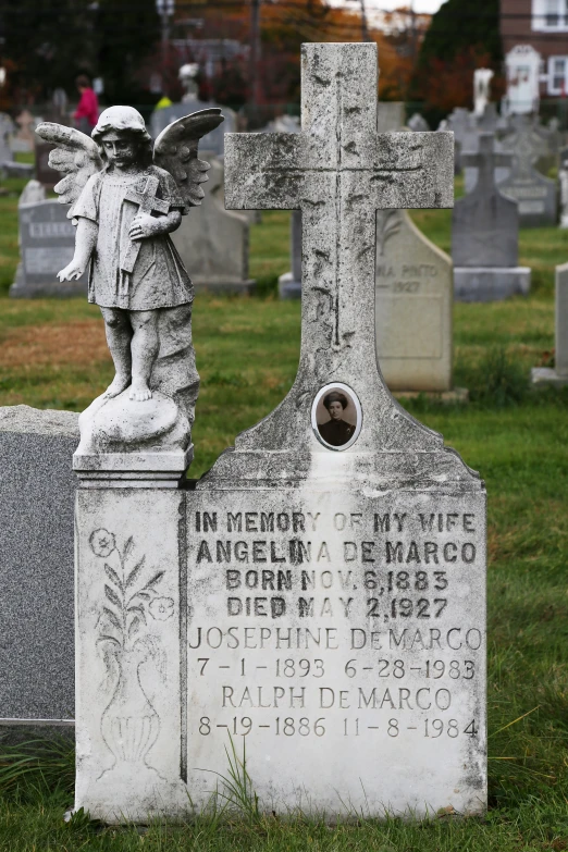 the cemetery has two headstones that have angels on them