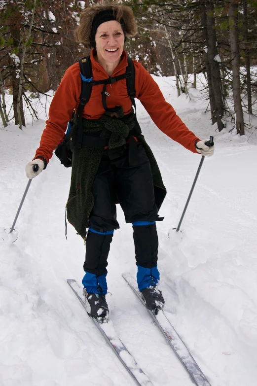 a woman wearing skis on the snow