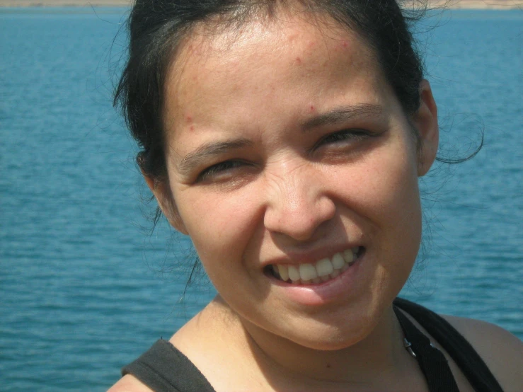 a close up of a young woman posing for the camera