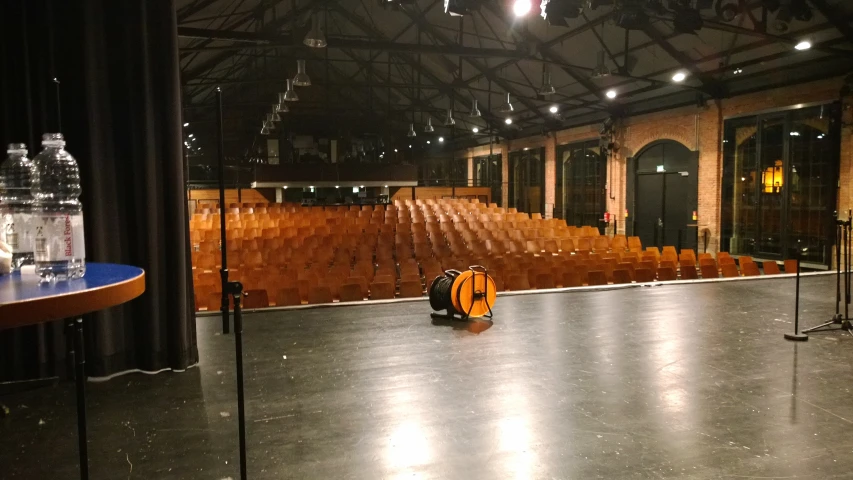 a large empty auditorium with lights shining in